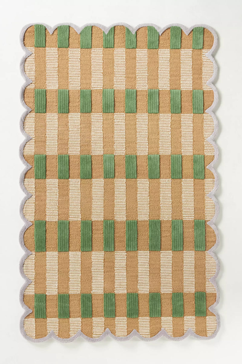 Woven mat with a checkered pattern of green and beige on a white background